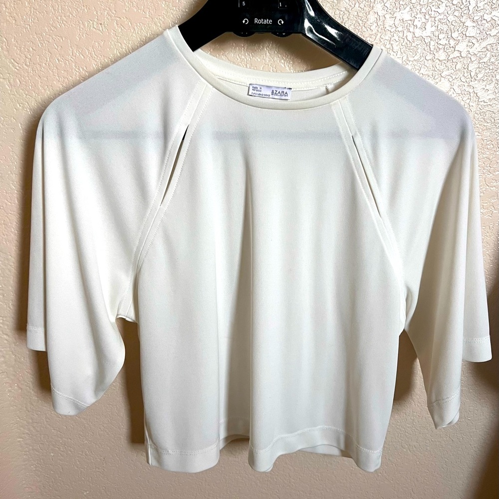 Zara: Women’s white knit 1/2 sleeve shirt.